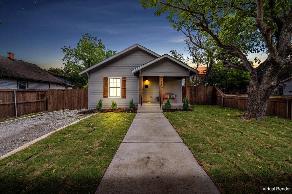 Exterior with fenced in yard at this two-bedroom, one-bathroom vacation rental house for five located just 5 minutes from Magnolia, Baylor, and all things downtown Waco.