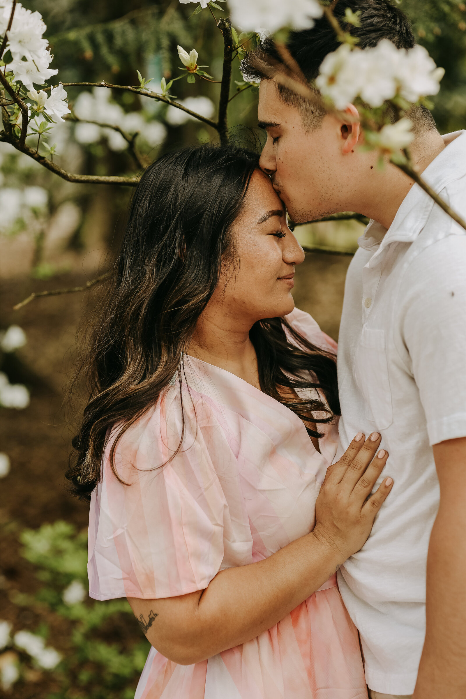 Robert kisses the top of Alexa's head in a tender moment shared at Dixon Gardens.