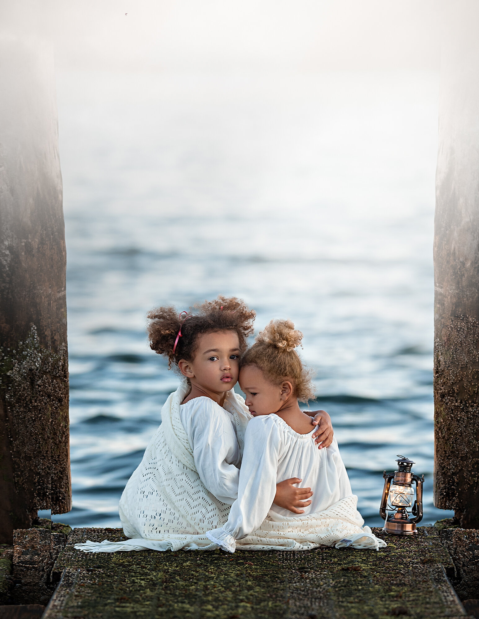 Children hugging at sunset on a cloudy day by Iya Estrellado, a Norfolk photographer