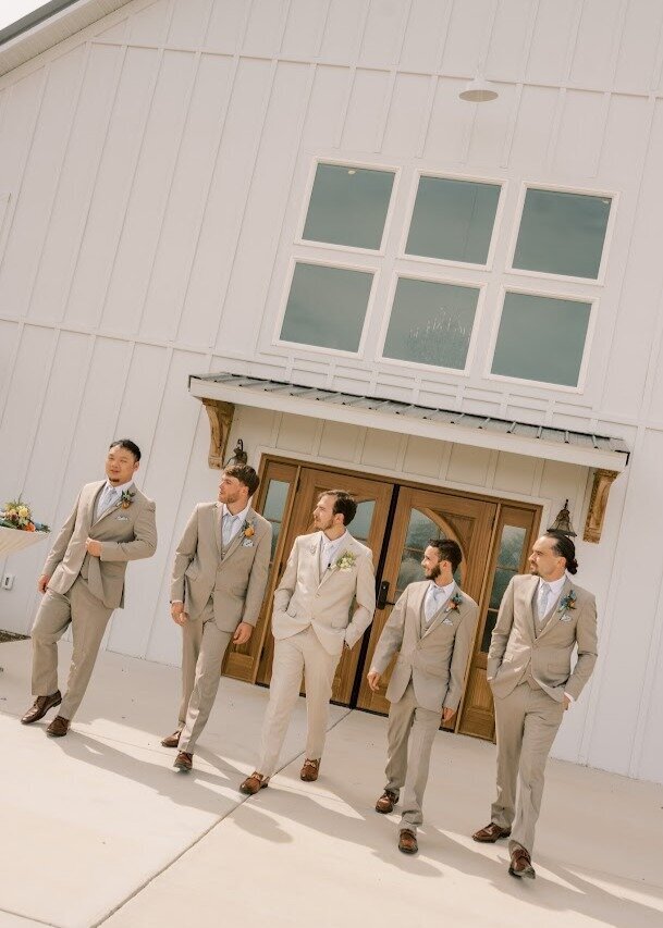 Groom-Groomsmen-Walking-Double-Door-The-Legacy-at-Willow-Pond.JPG
