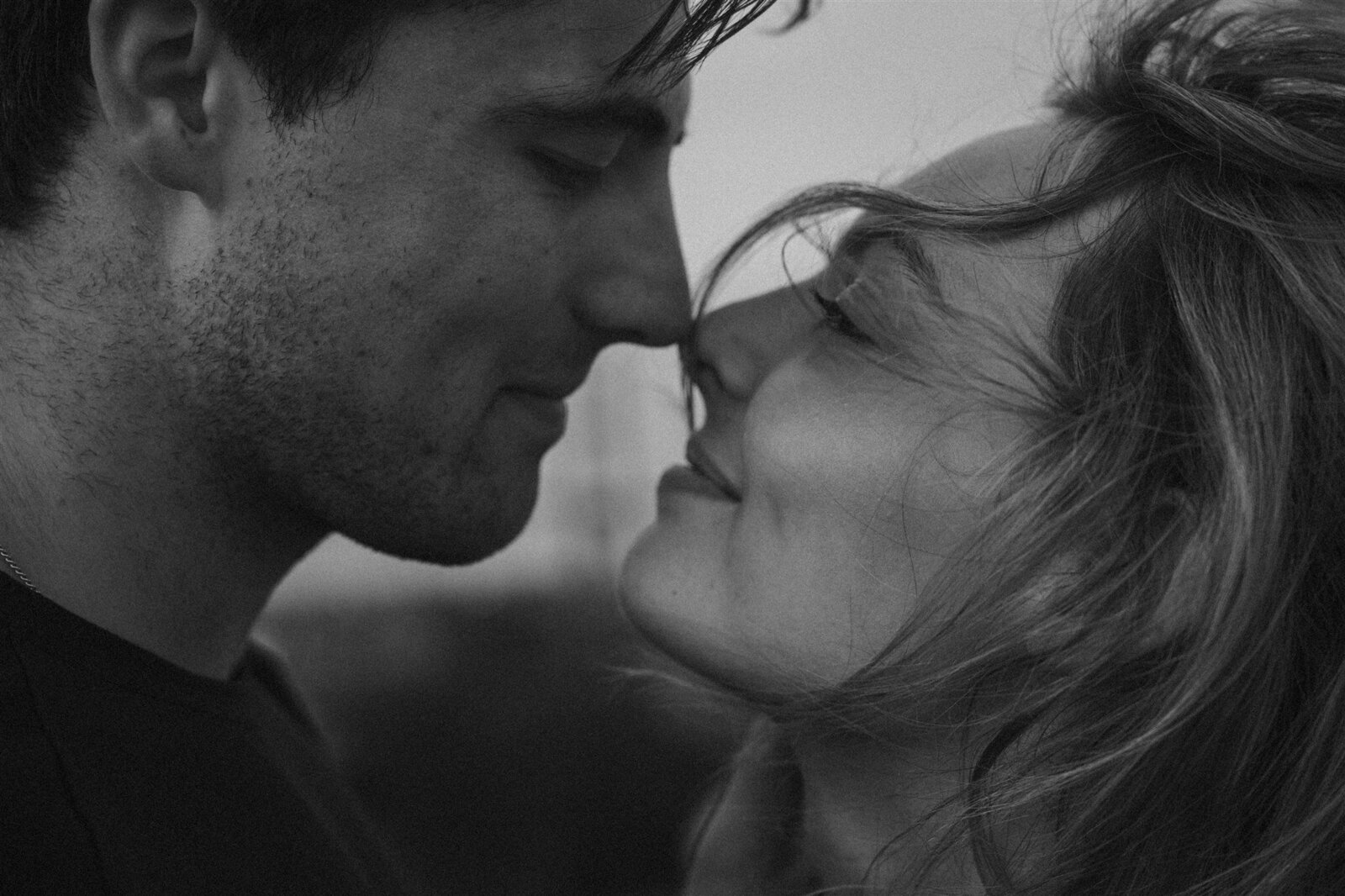 couple touching noses almost kissing in Savannah, Georgia 