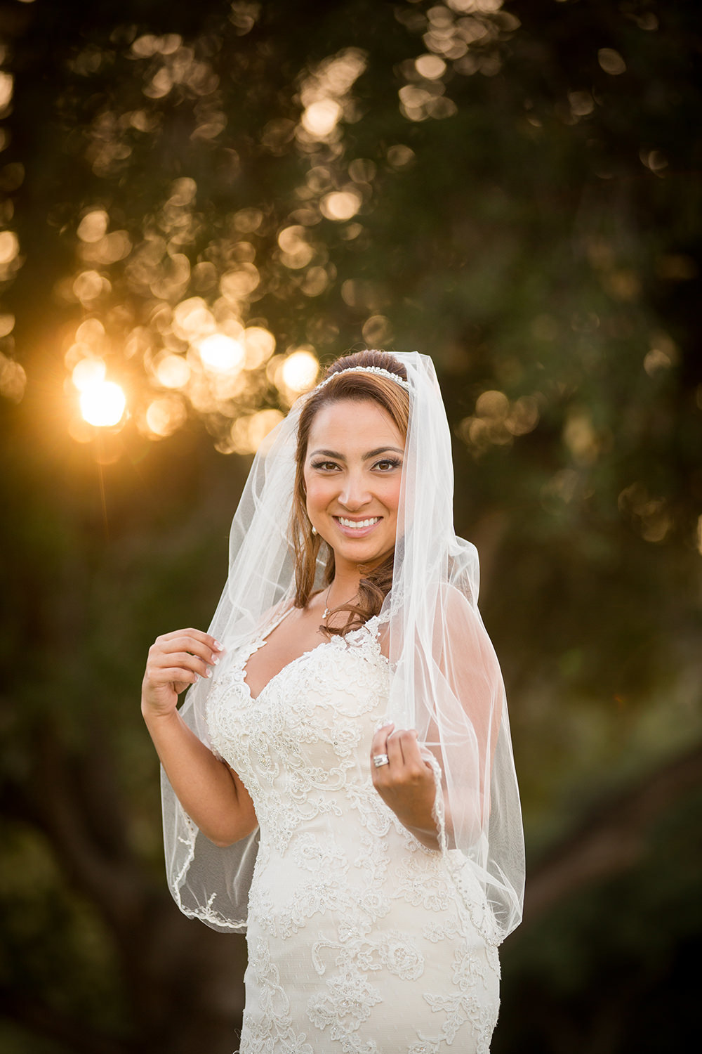 bride with stunning veil at sunset