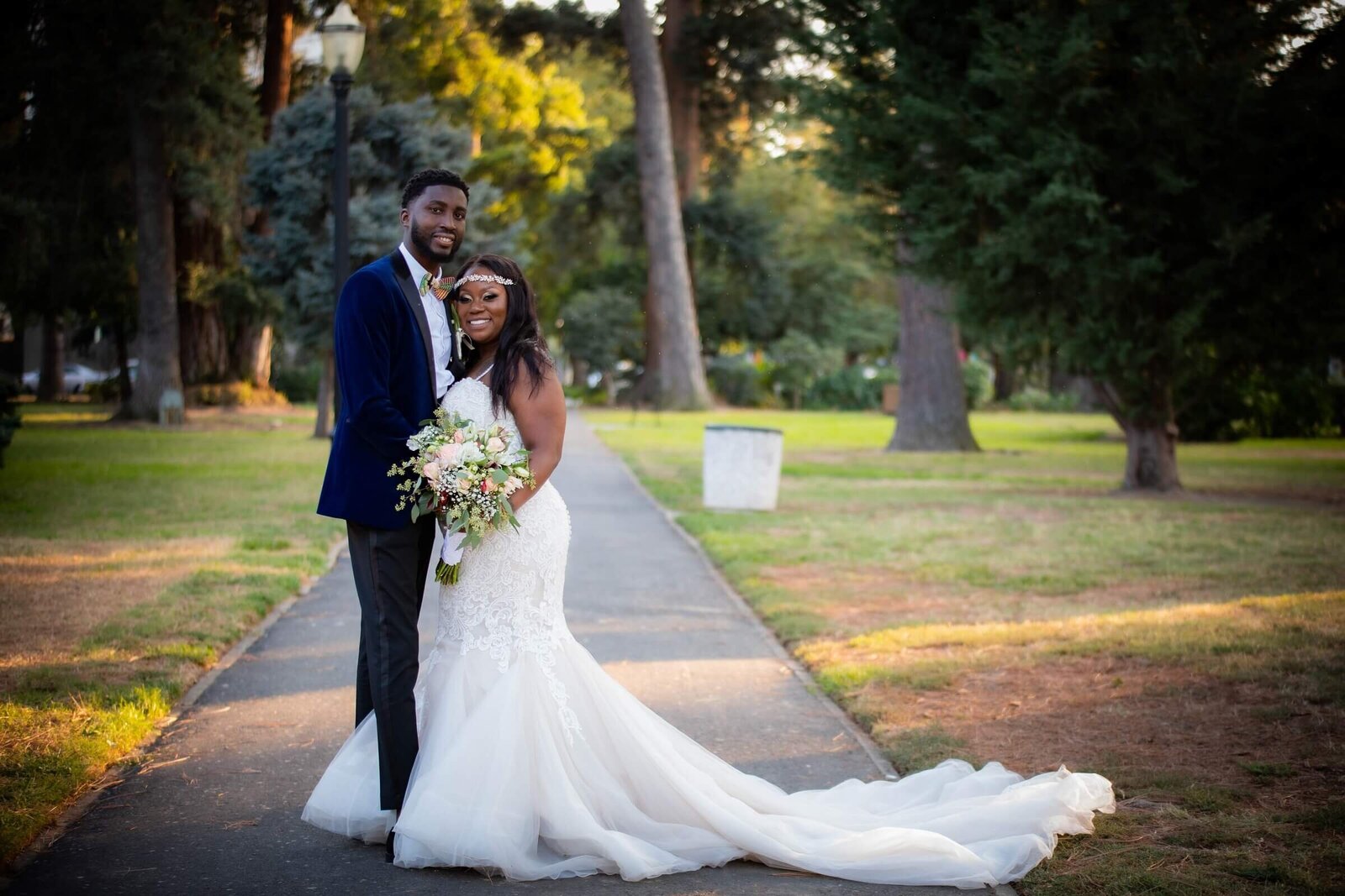 Sacramento wedding photographer, philippe studio pro captures couple in traditional wedding picture in Capitol Park.
