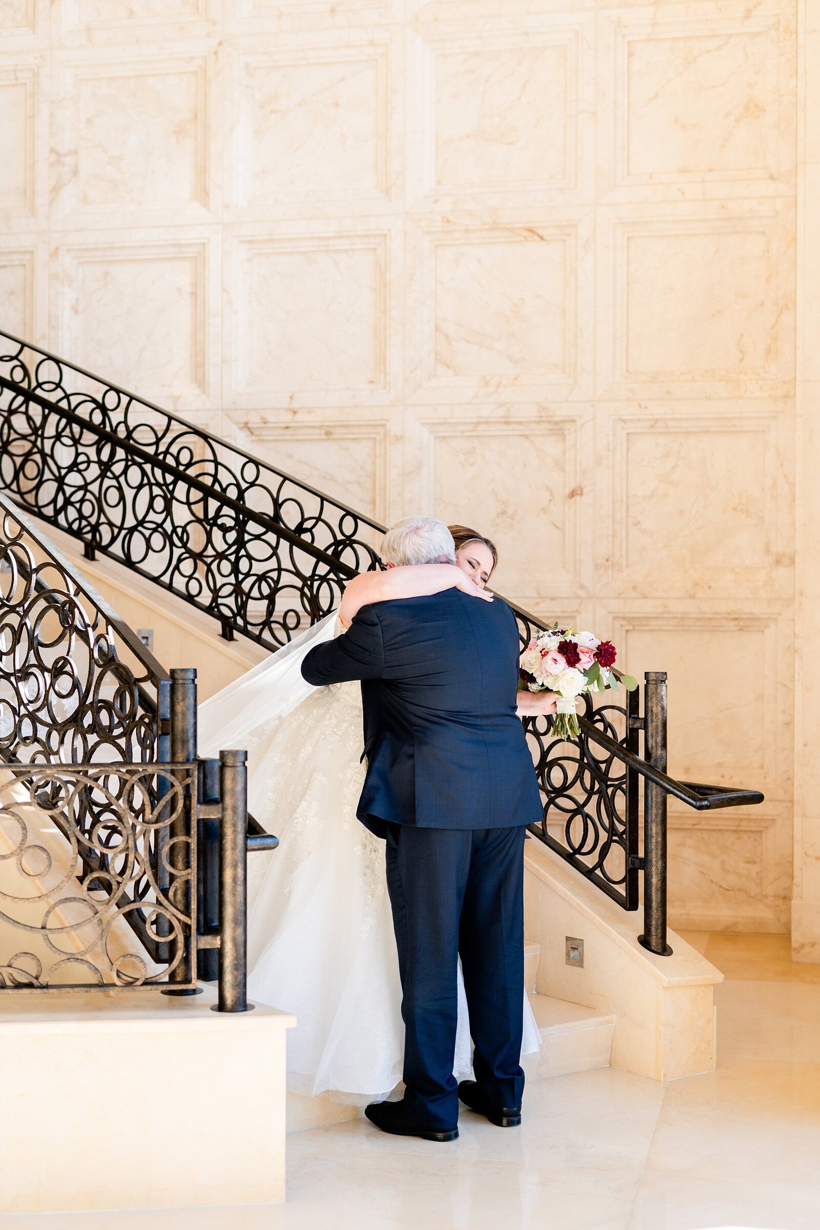 father hugs daughter on wedding day | Four Seasons Wedding | Chynna Pacheco Photography