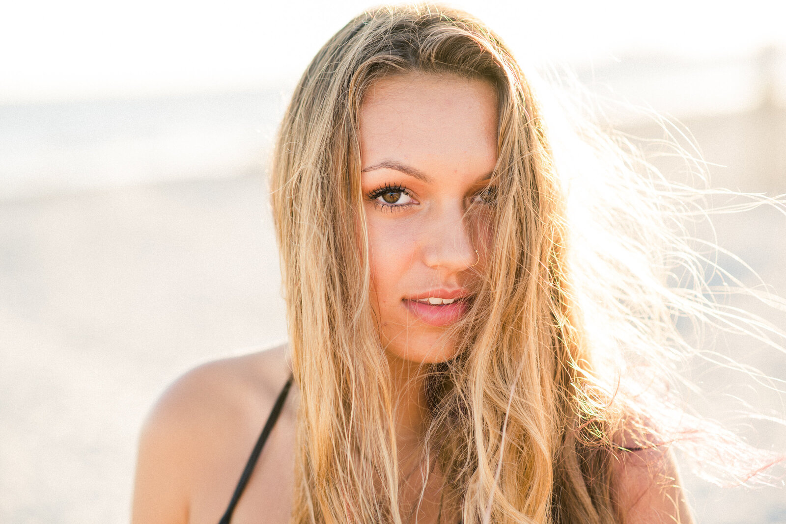 close up of girl in sunlight on beach