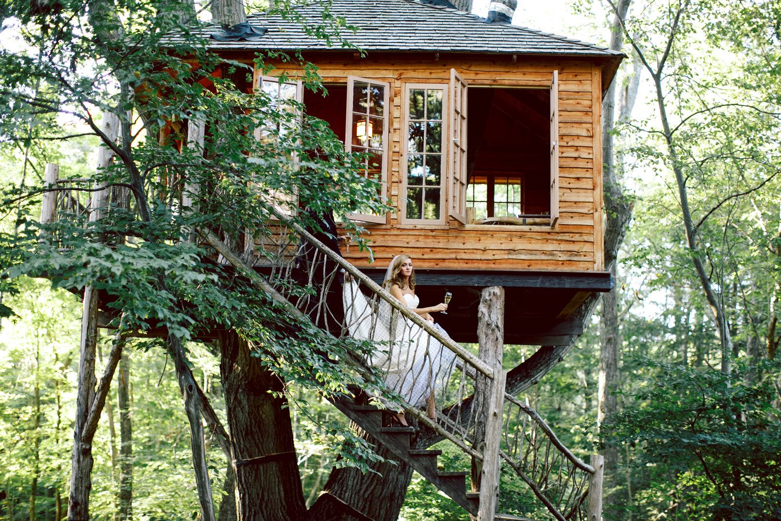 bride walking down treehouse steps