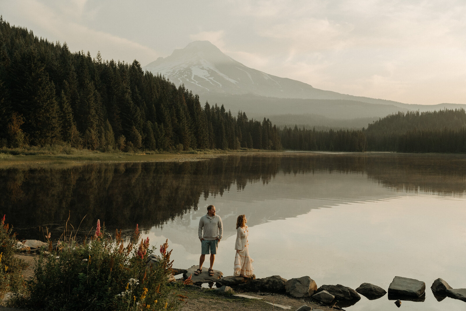 Adventurous engagement couple taking candid natural photos at the Oregon Coast