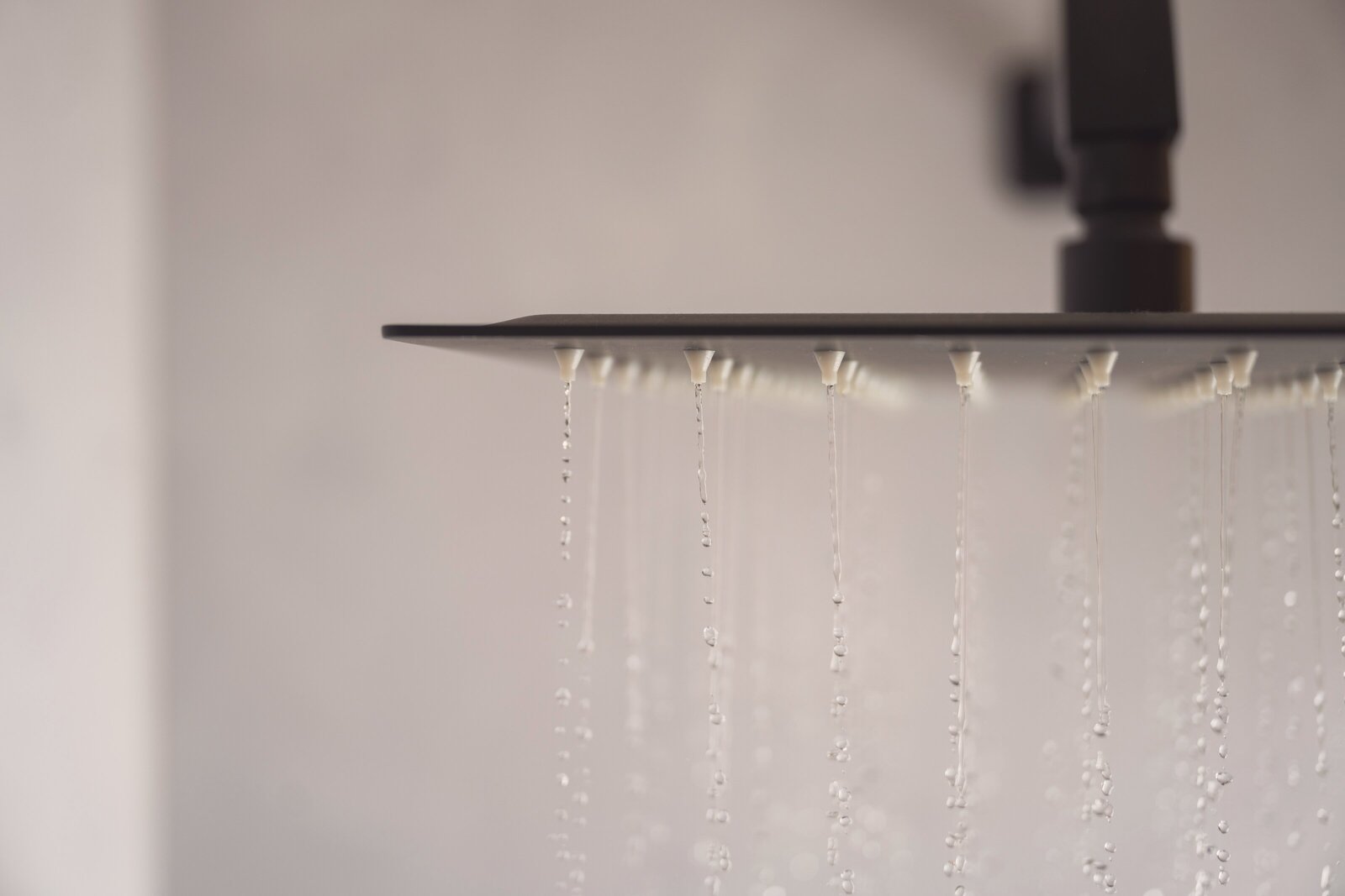 lose-up of a rain shower in a Tiny Home at The Campus Alps.com, offering a luxurious and refreshing experience