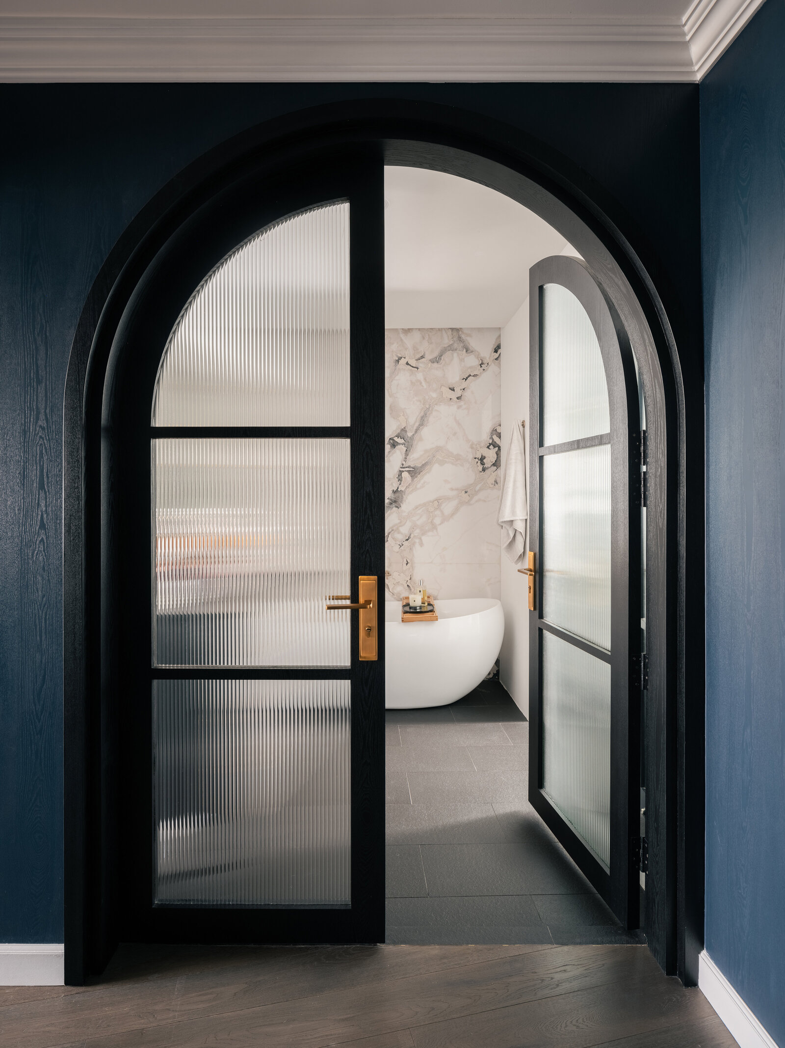 Arch doors leading to hallway