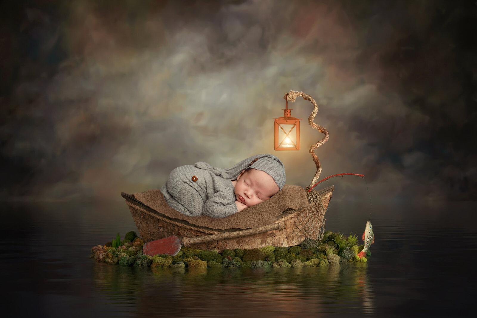 baby on a boat fishing in a photoshoot setup