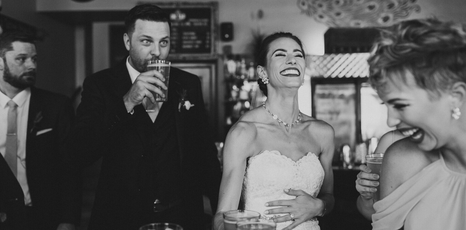 Bride laughing at toast at her Philadelphia wedding reception