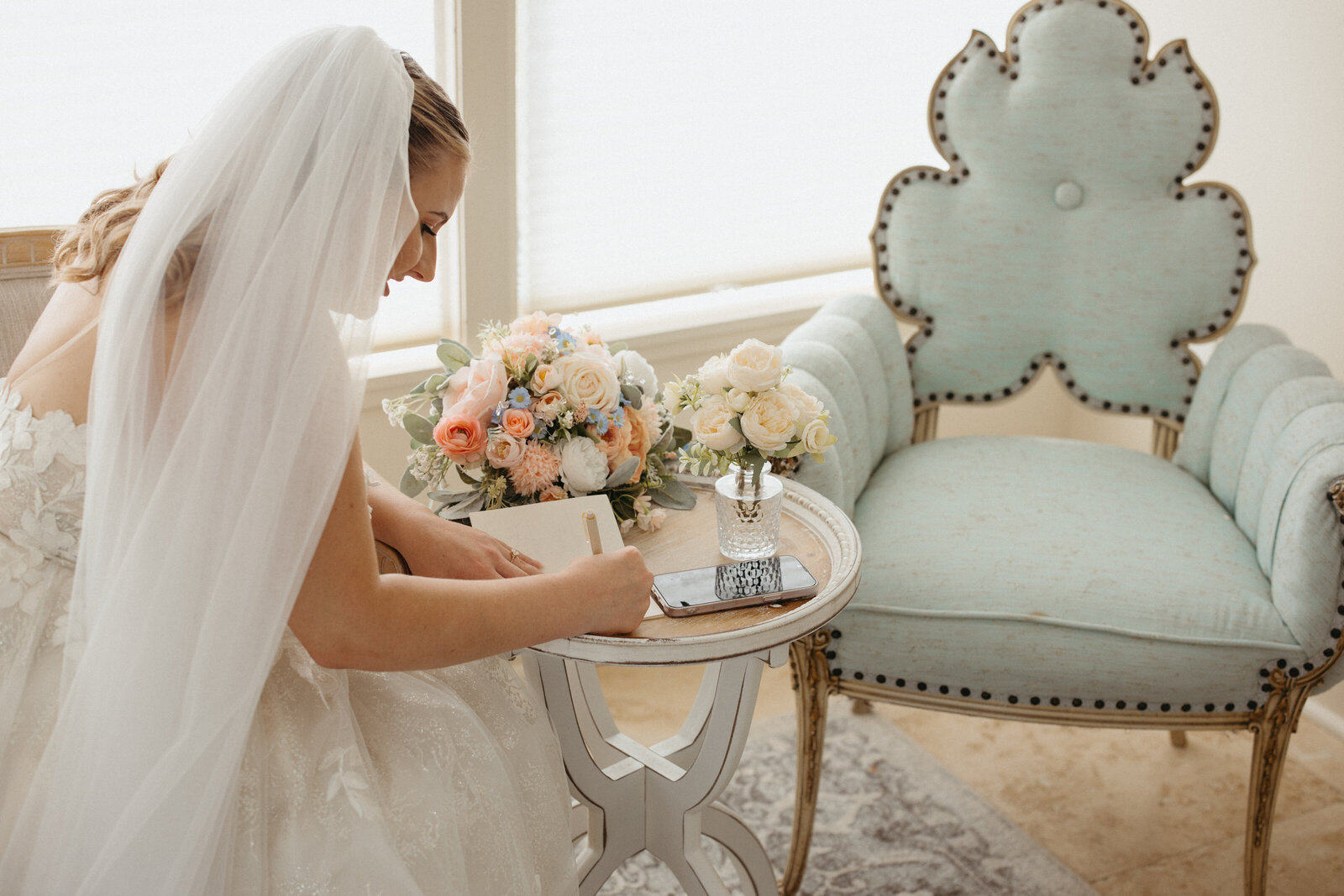 Bride writing notes to guests