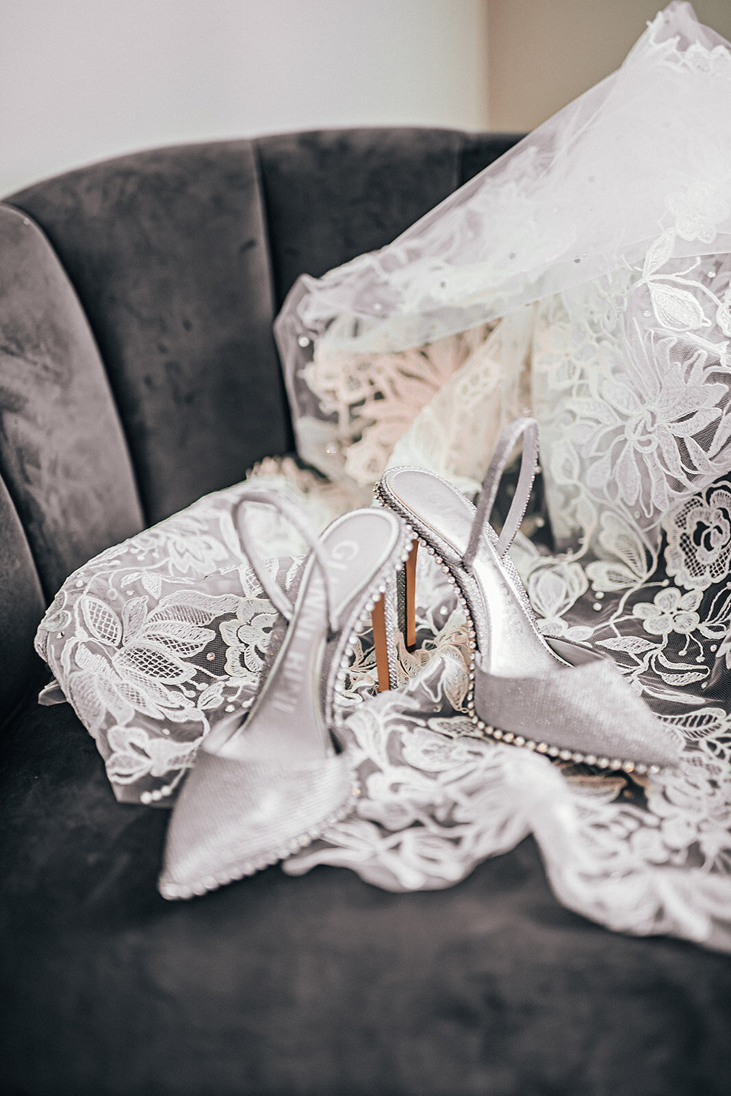 Beautiful lace veil and silver wedding shoes  with embellishments