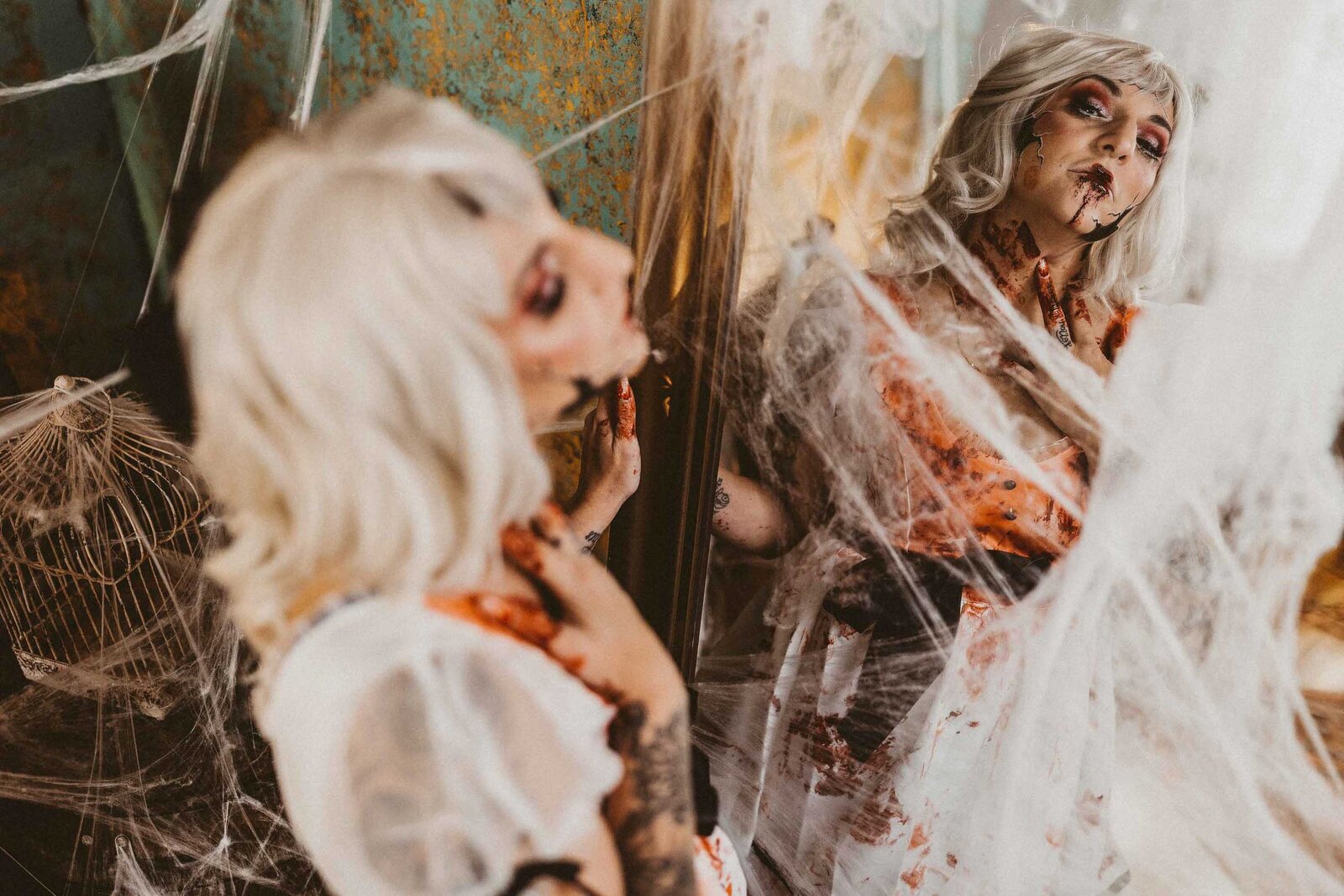 woman in a halloween make up facing in the mirror