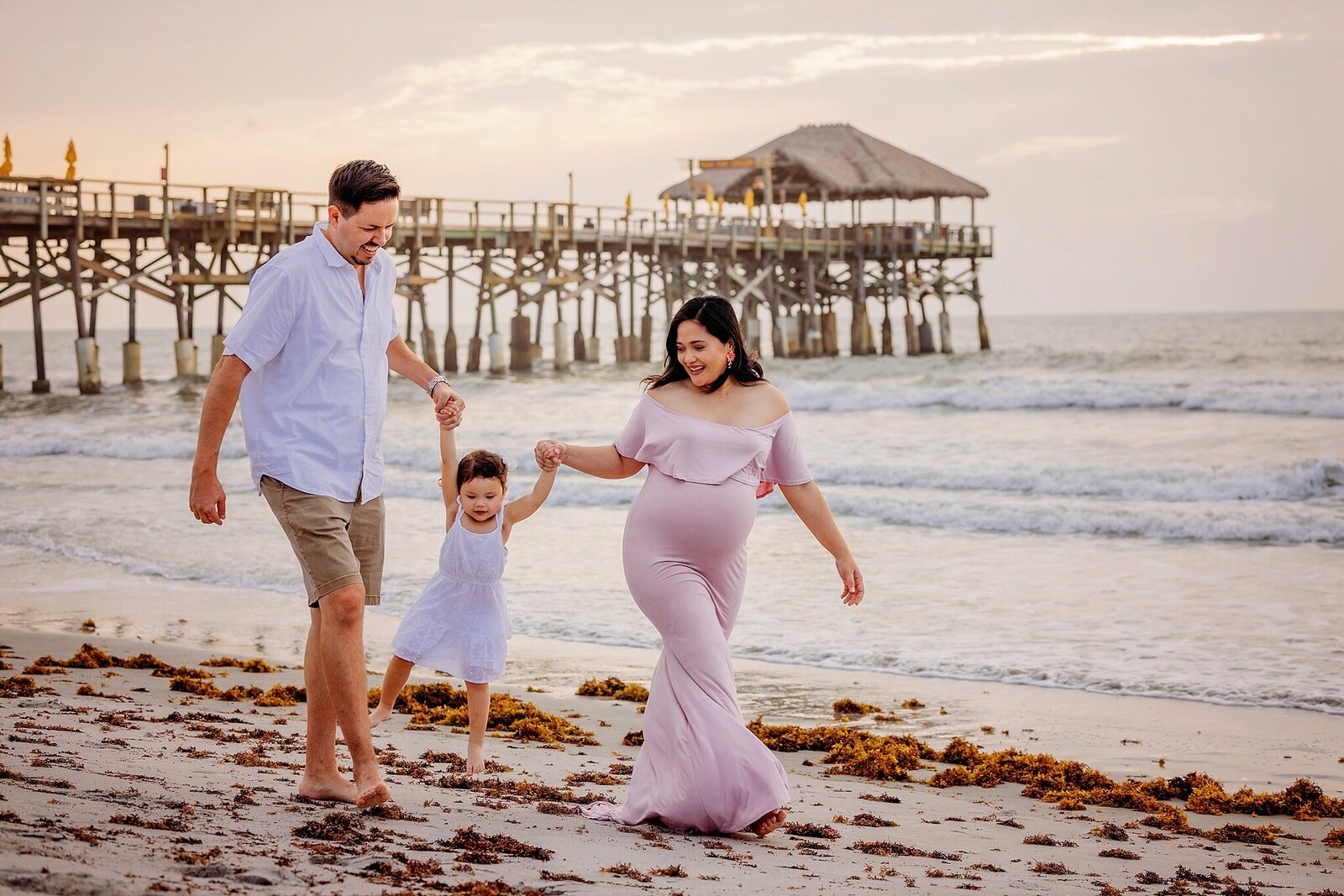 Bia Schaefer captures a stunning maternity session at Cocoa Beach, FL, highlighting the joy of pregnancy by the sea.