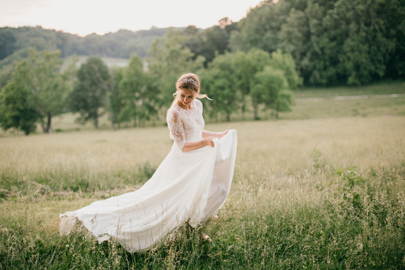 Bride wandering the open fields at her family estate.