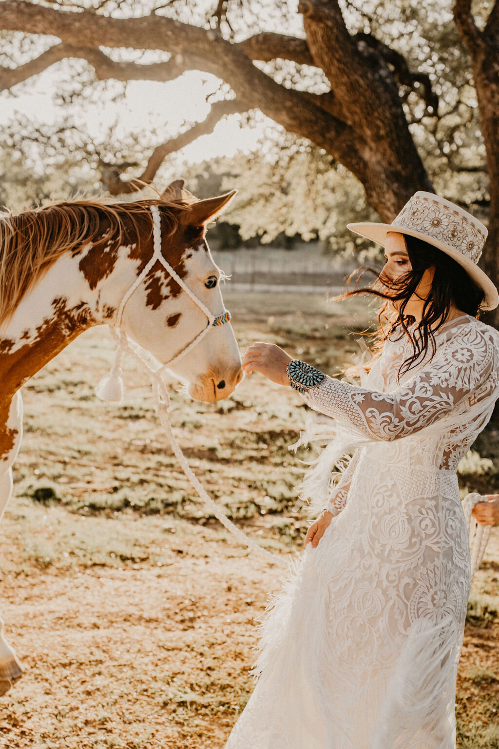 bride in lace dress with horse