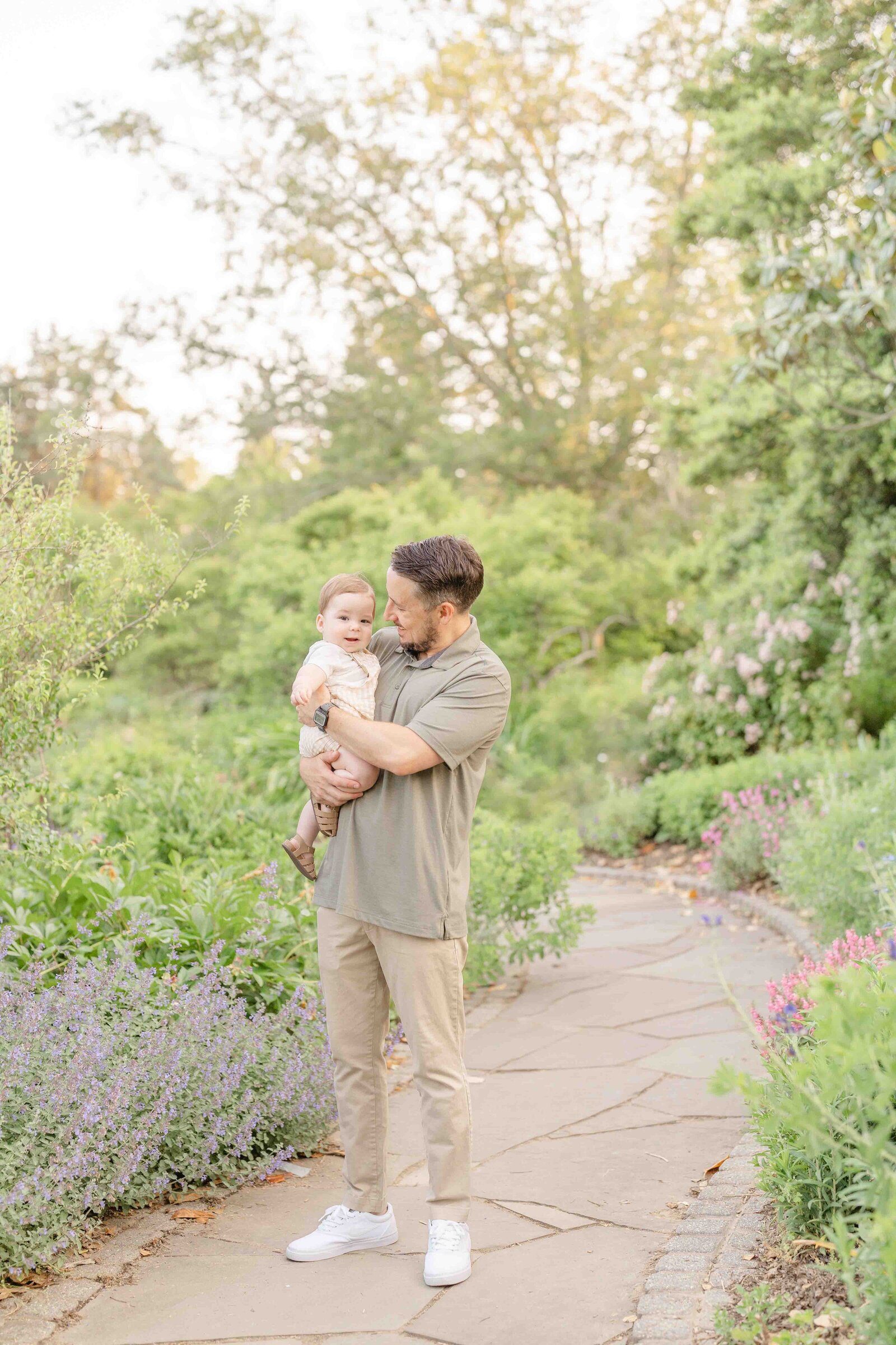 dad playing with baby during spring mini session in Fairfax County, VA
