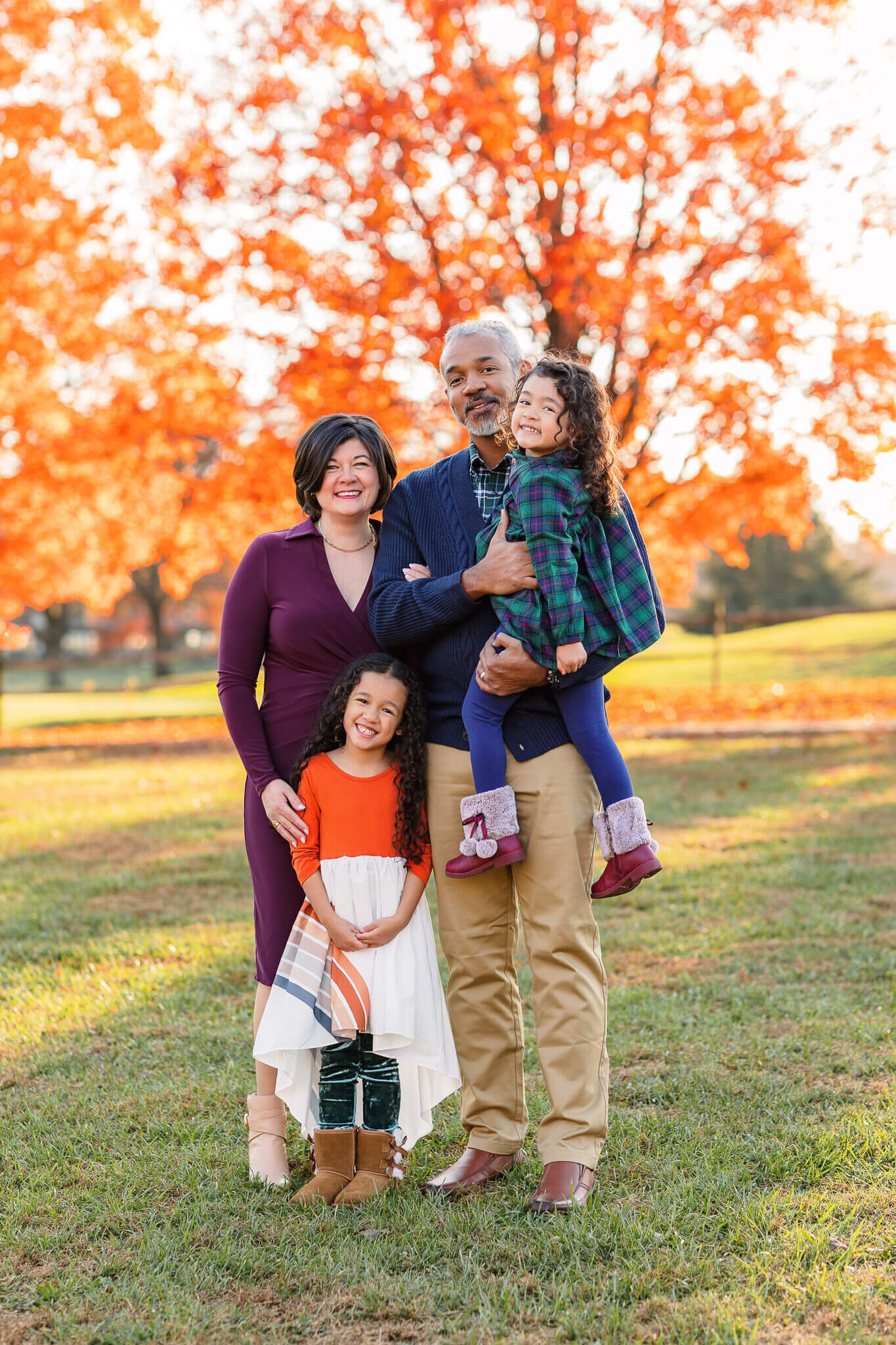 A family posing among the fall foliage