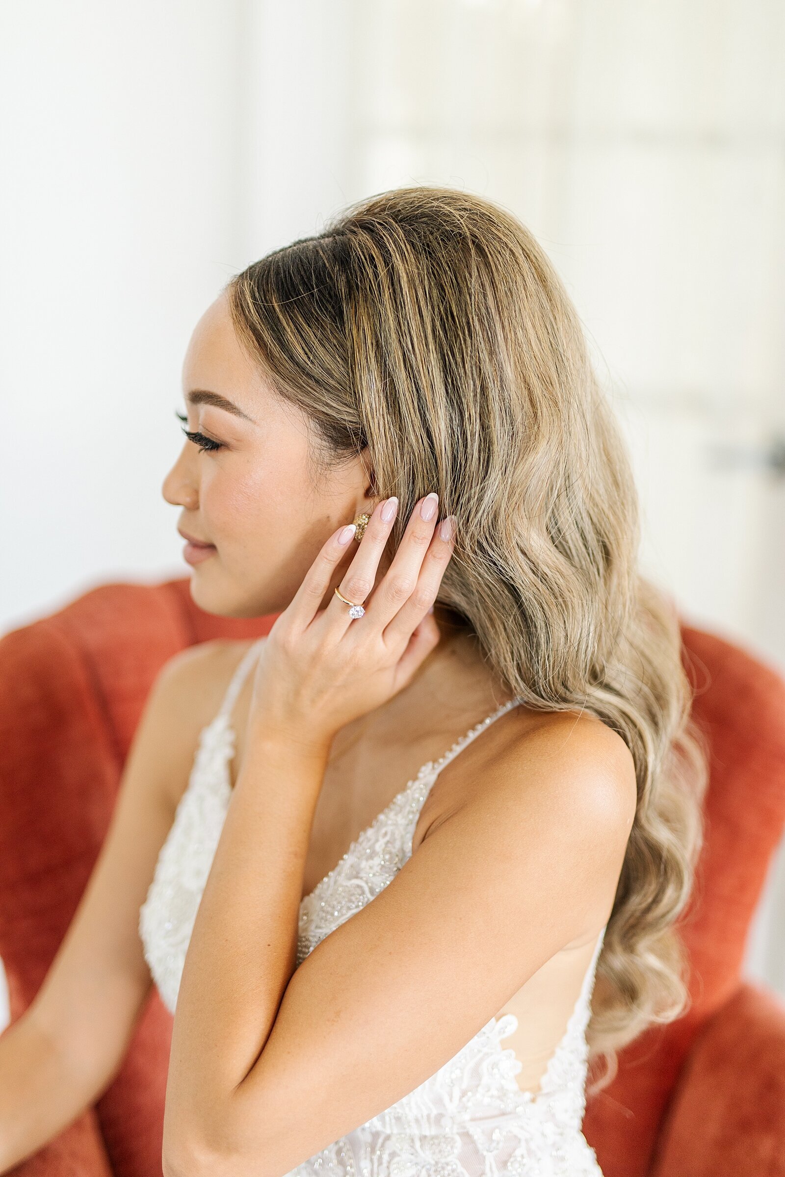 Bride playing with her hair in the bridal suite at The Ebell of Long Beach in Long Beach, California filmed by wedding videographer, Sherr Weddings.