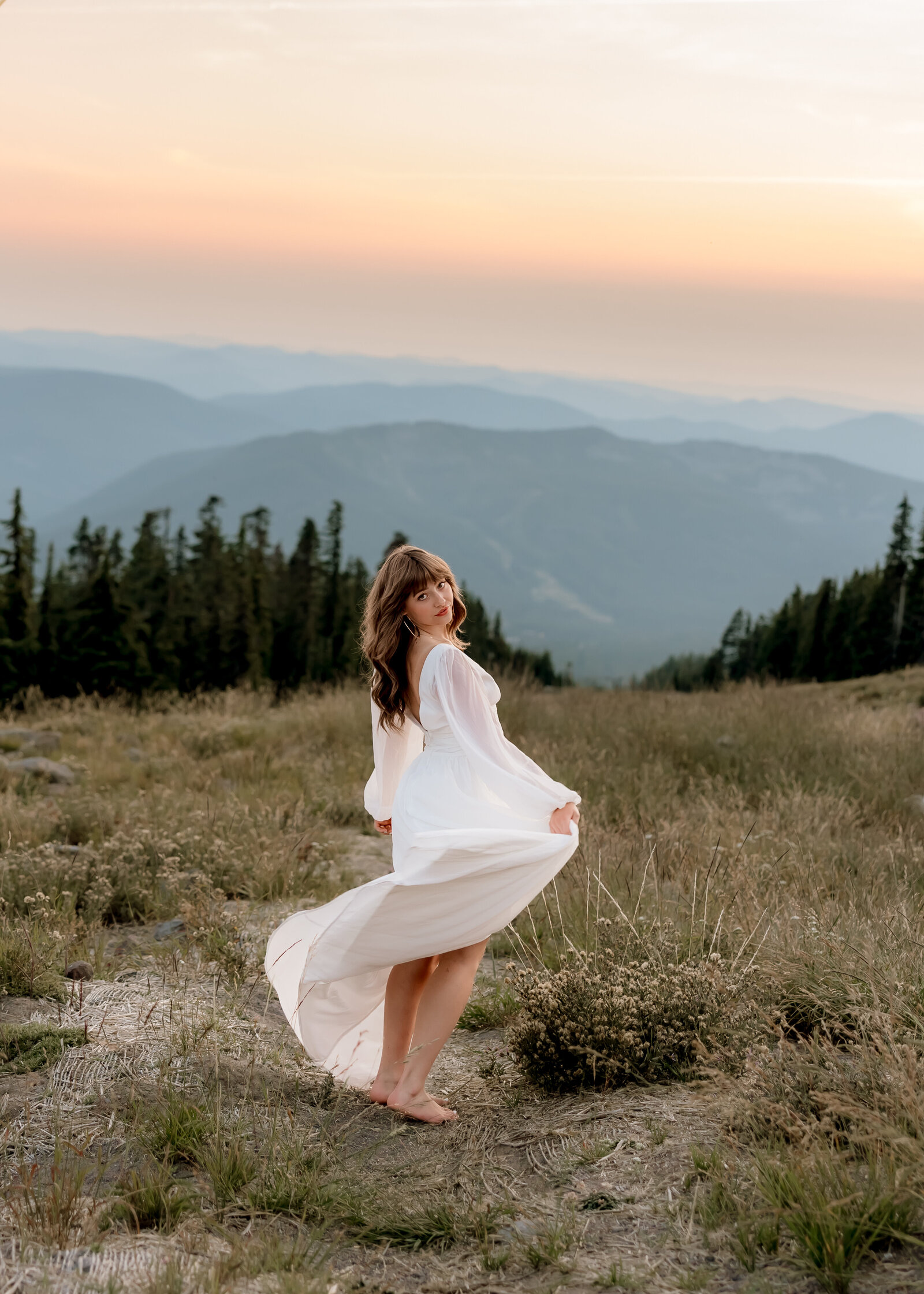 Sandy High School senior doing senior portraits at sunset at Timberline Lodge.