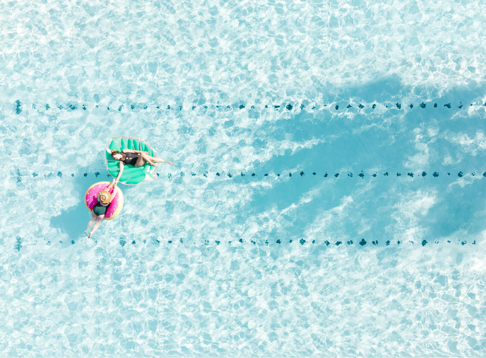 Swimmers floating in pool