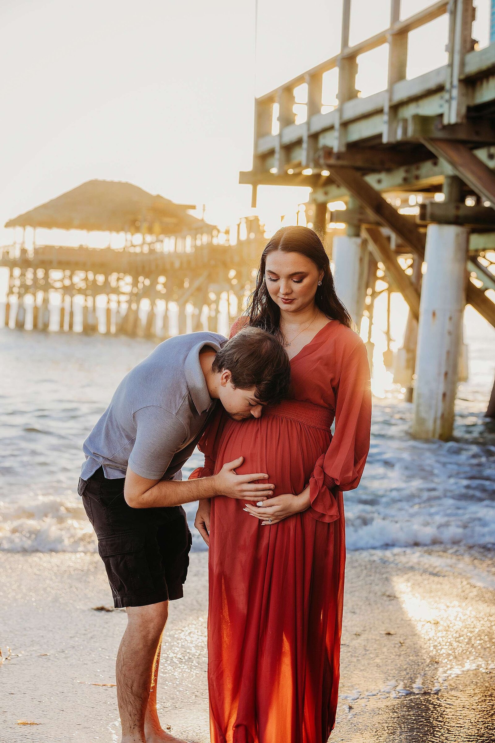 Beautiful pregnancy photography by Bia Schaefer at Cocoa Beach, FL, showcasing a serene maternity session.