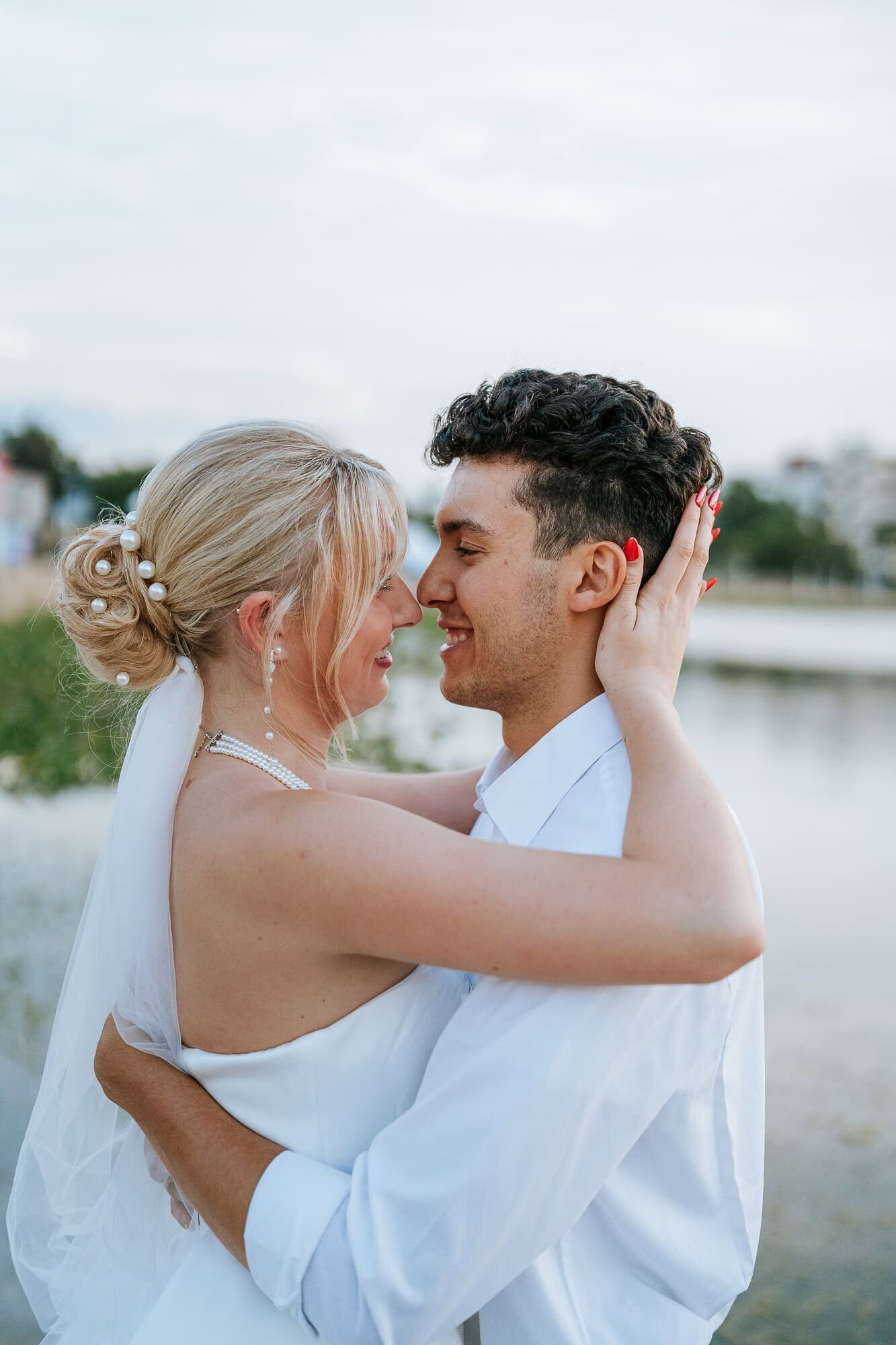 Golden hour couple portraits at Lake Mirror - Magnolia Building Wedding - couple sharing an intimate moment