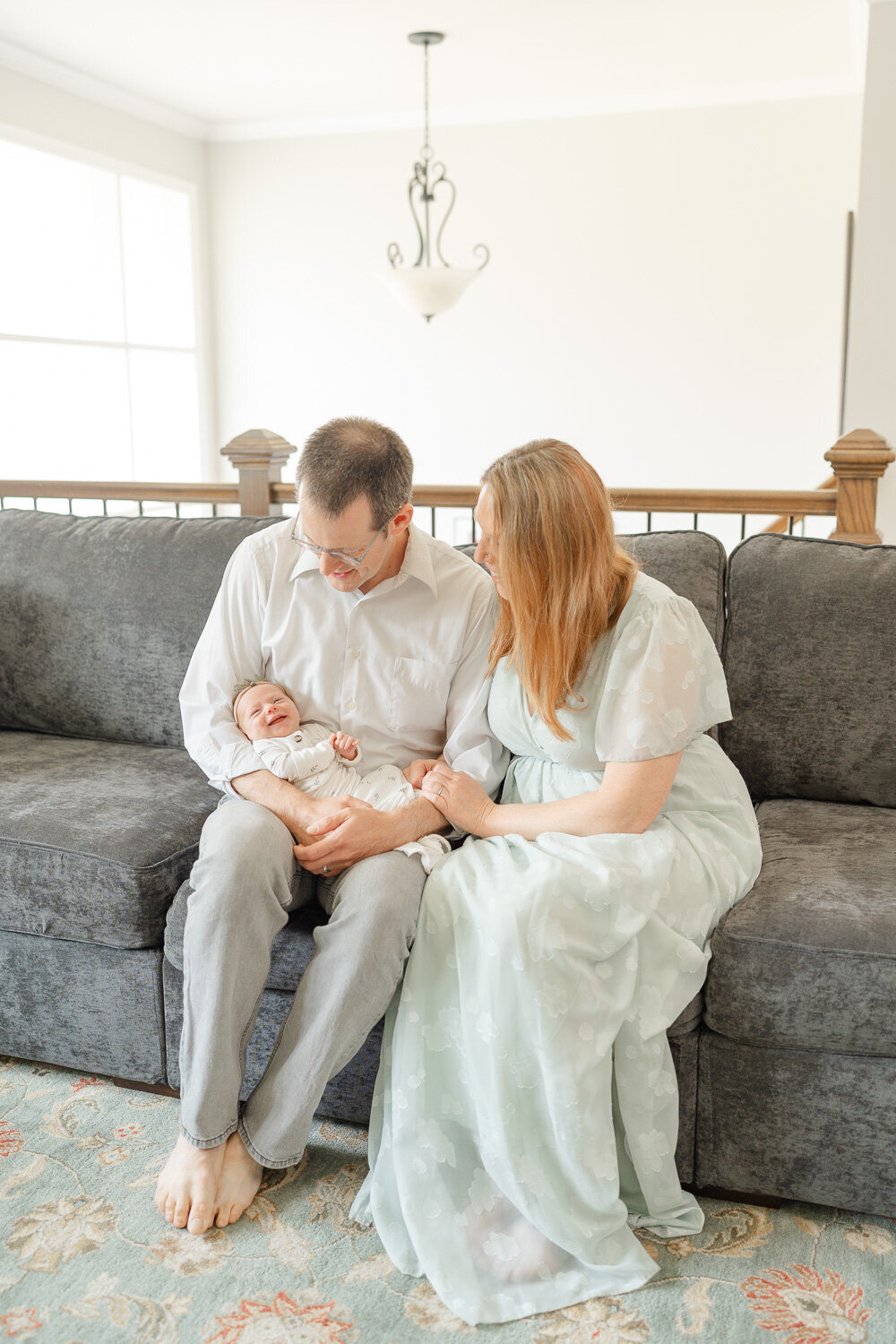 parents looking at baby during newborn session in Fairfax County, VA