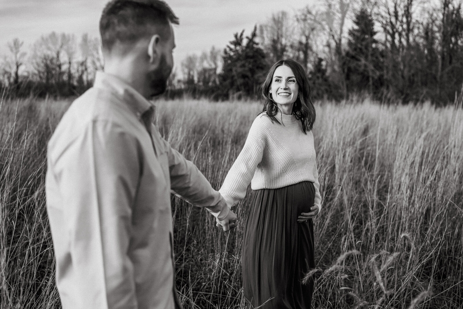 couple walking through the field