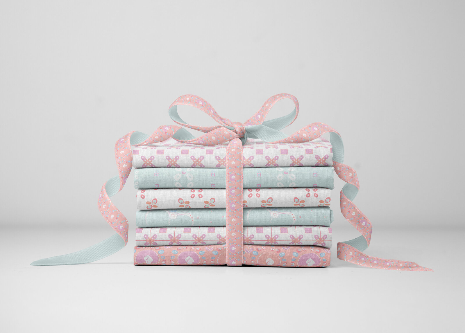 Stack of patterned fabrics tied with a bow