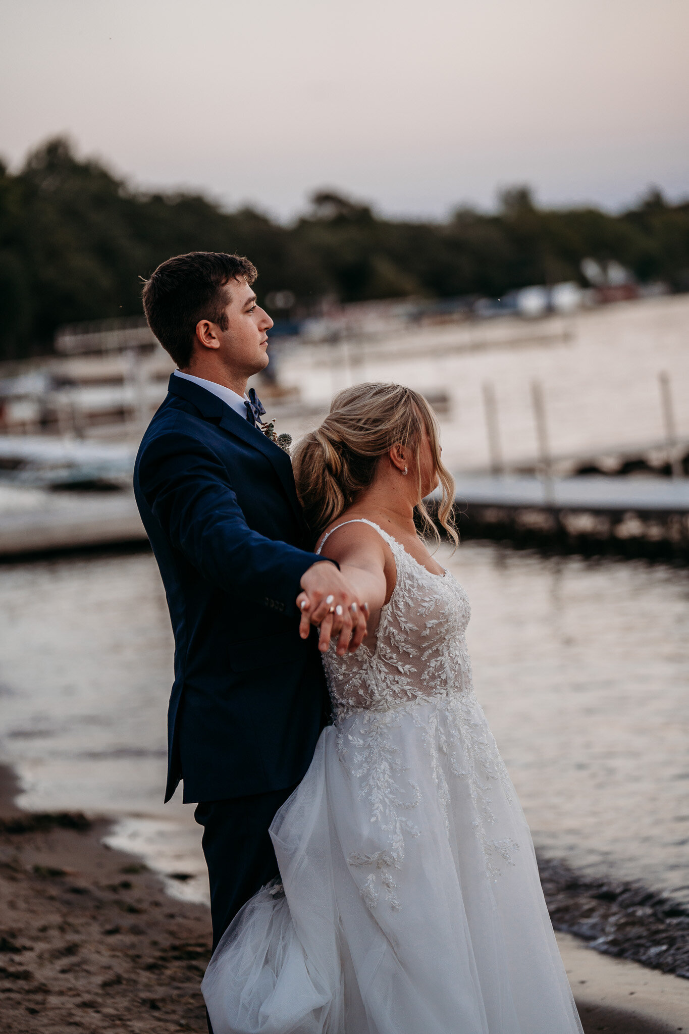 bride and groom on the beach at sunest