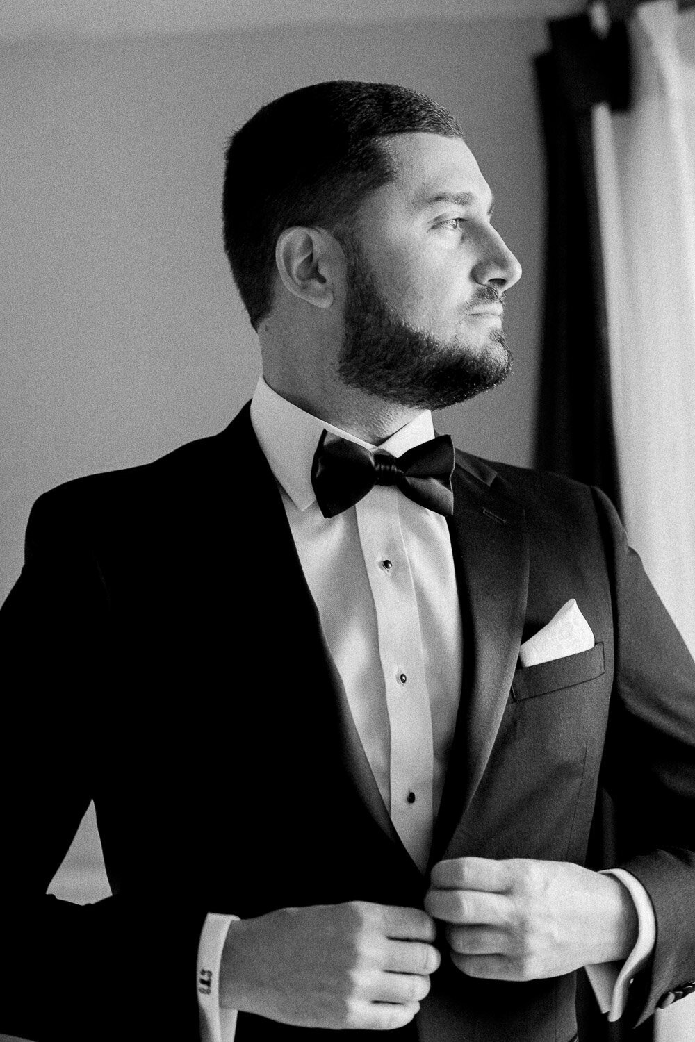 groom button tux in window