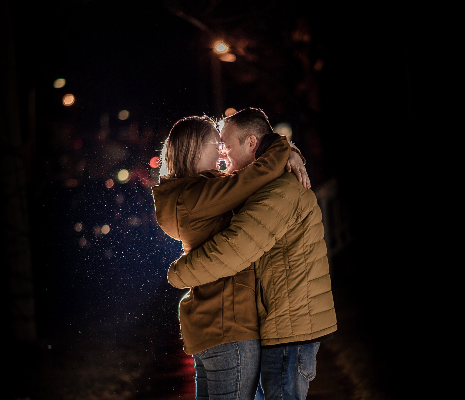 backlit couple in rain in burlington vermont