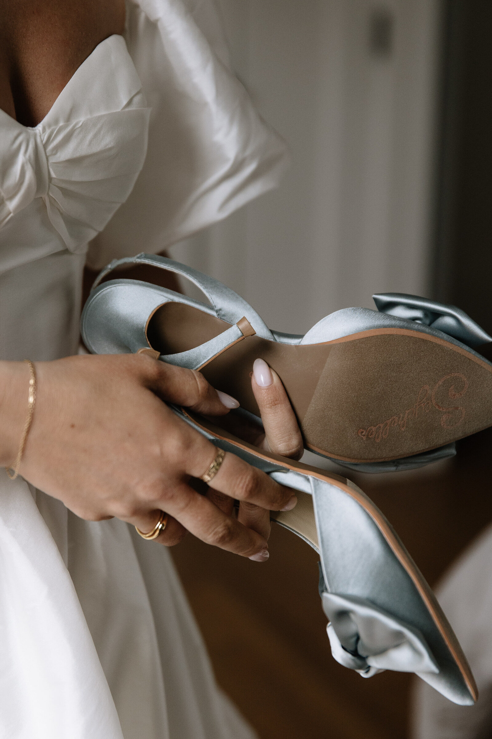 Bride holding her heels during first look at Boise wedding in Idaho