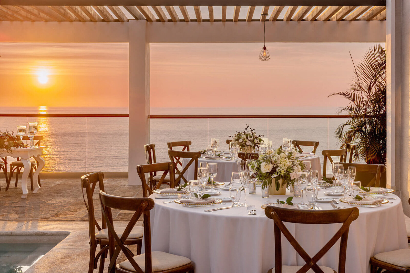 Dining table at a resort while overlooking sunset