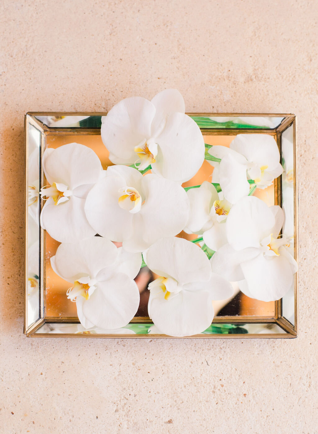 white flowers on a tray for Destination wedding at Hotel Esencia in Tulum Mexico