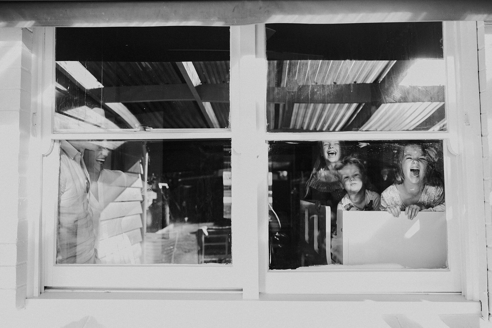 family in window melbourne photo session