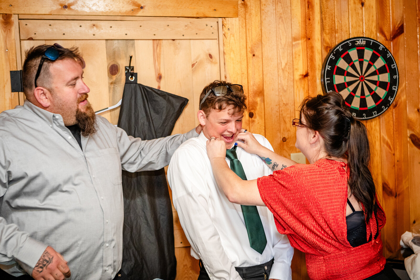 Parents adjusting tie