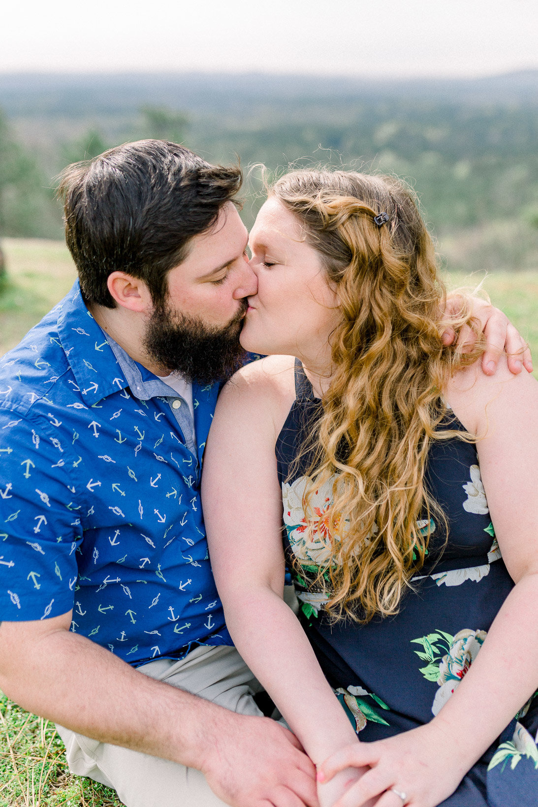 Kissing couple captured by Staci Addison Photography