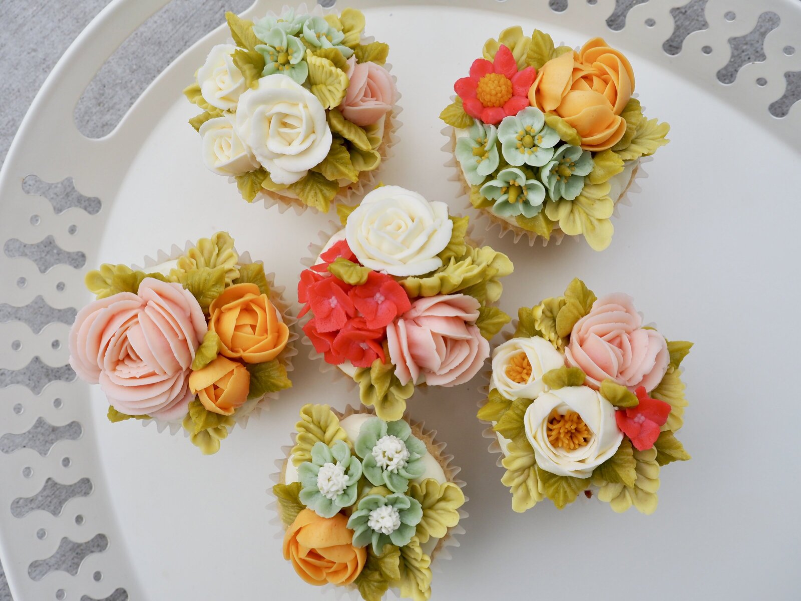 Set of floral buttercream cupcakes