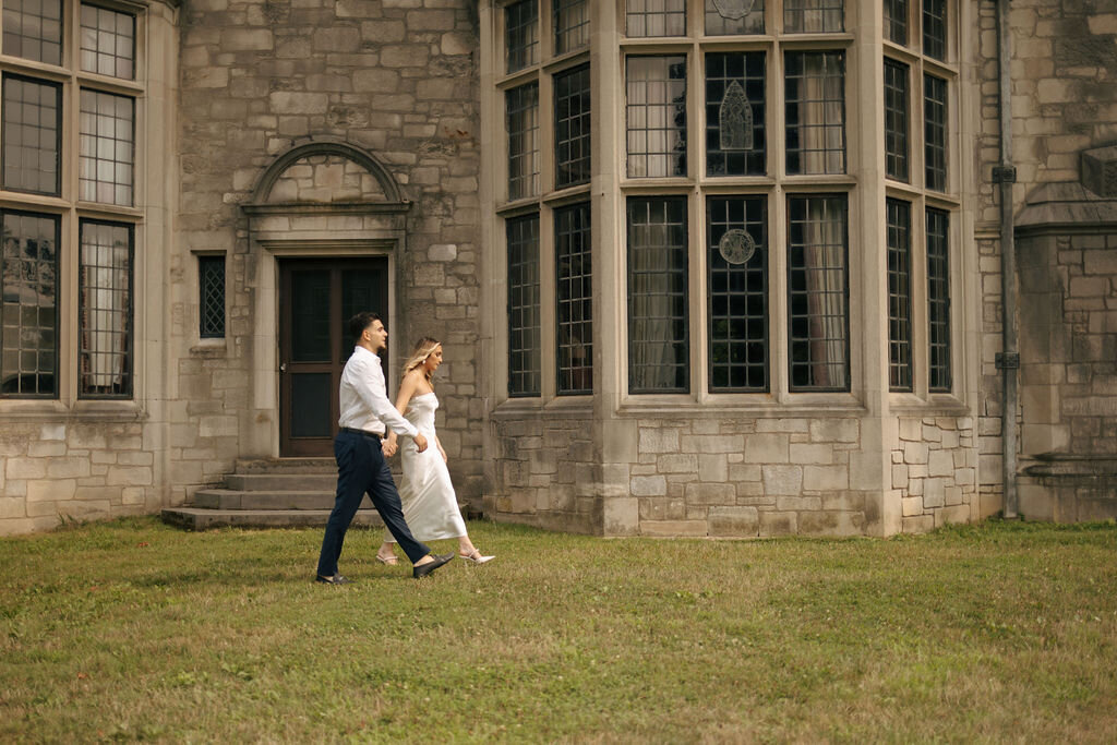 Newlywed couple walking in front of their brick wedding venue after saying their "I dos" in New York | Emma LeeAnn Photography