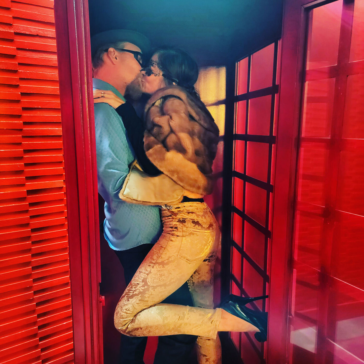 Couple kissing in phone booth