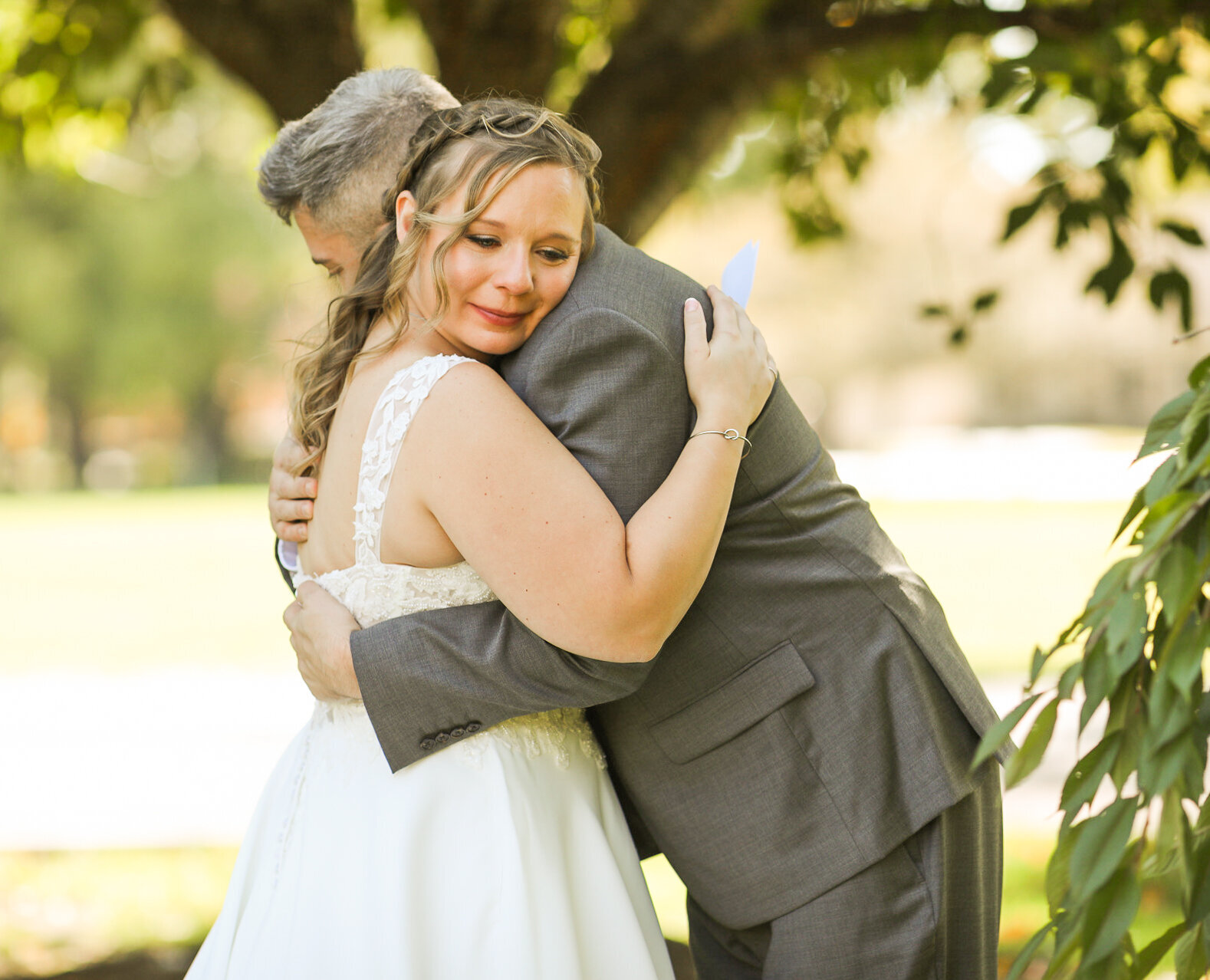 Bride and Groom hugging by Columbus Georgia Wedding Photographer Amanda Richardson Photography
