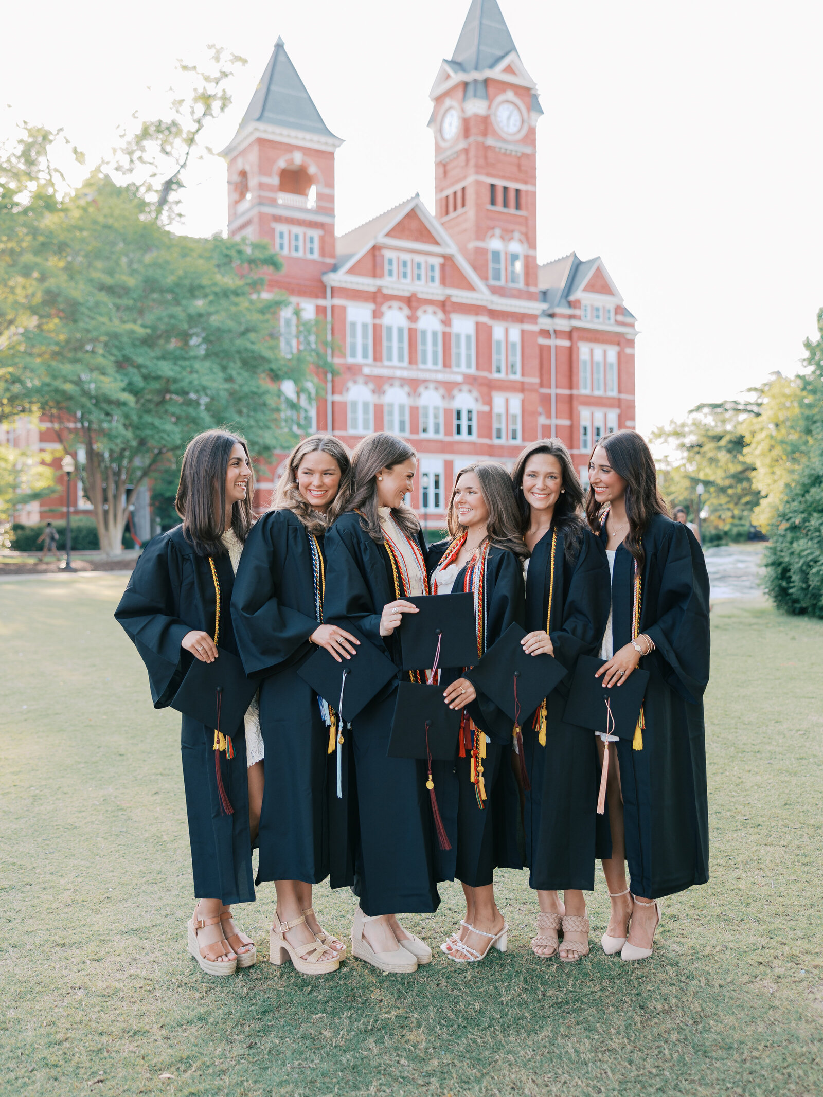 Classic senior photographer Alabama timeless outdoor natural light portraits with cap and gowns.