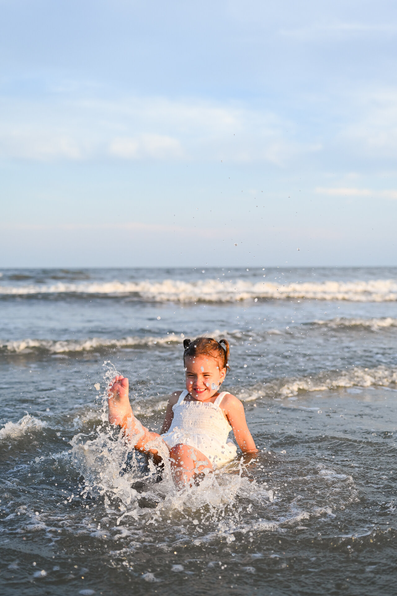 kid splashing on hilton head island beach
