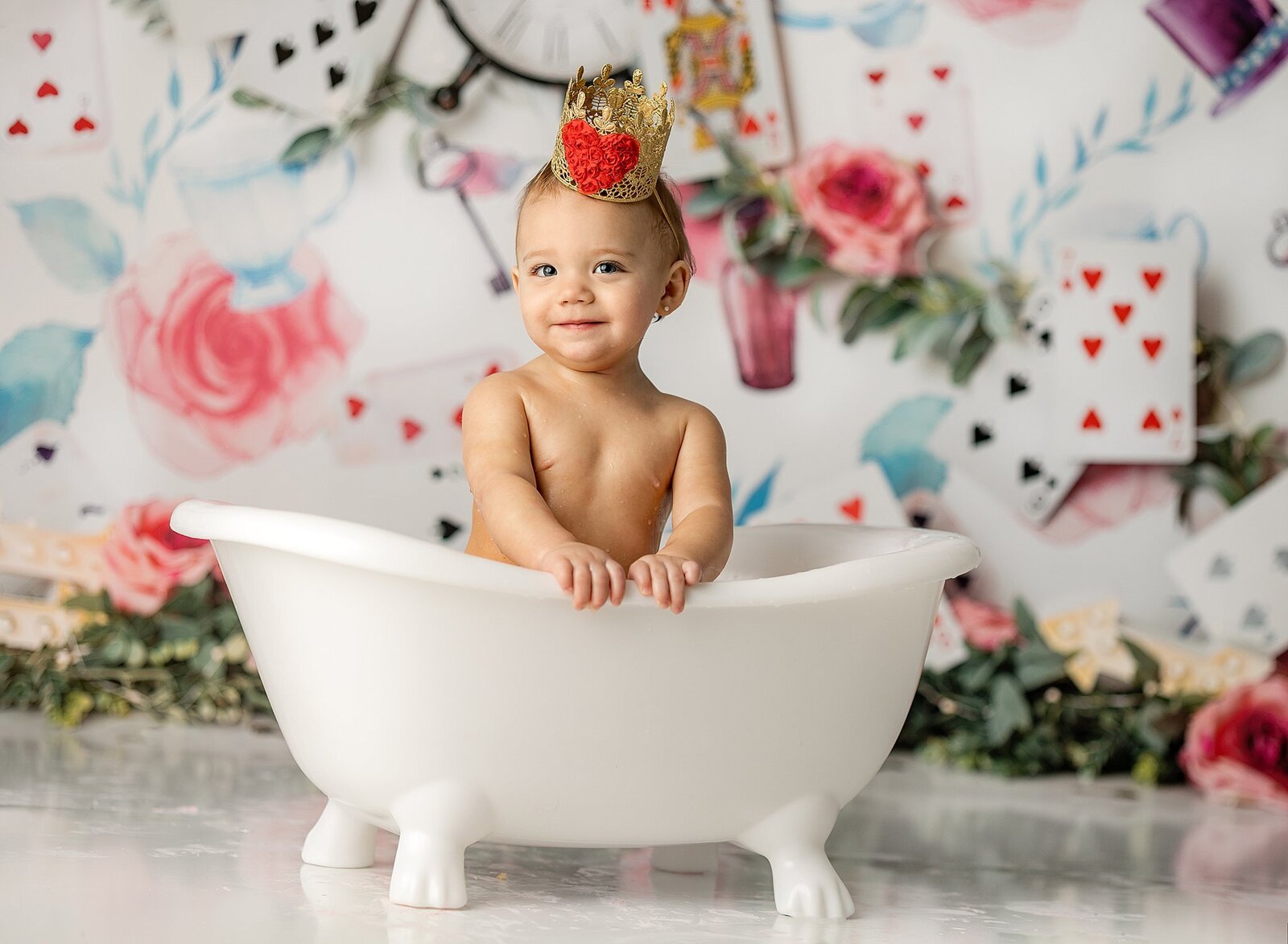 baby girl smiling in smash cake tub photos quad city.