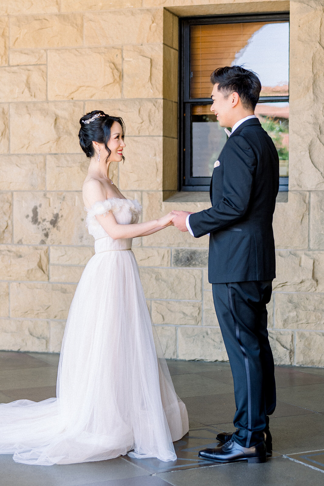 The bride and groom share a special first look moment at the beautiful Filoli estate in Woodside, California.