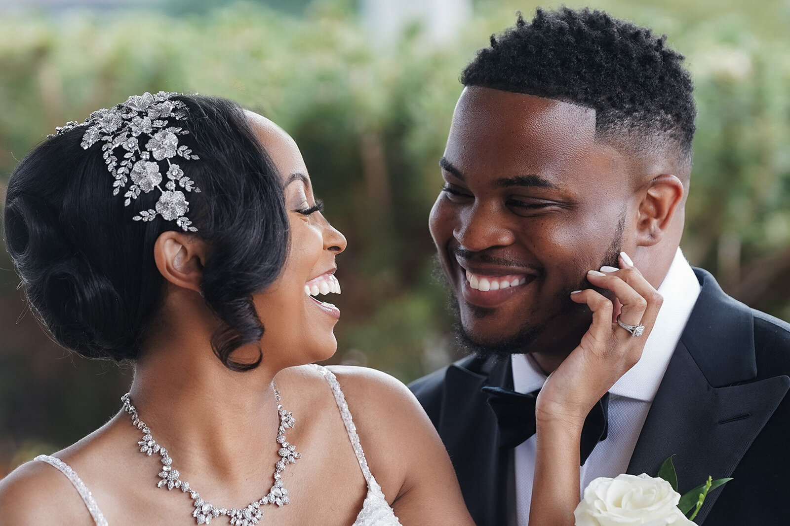 bride and groom laughing at each other