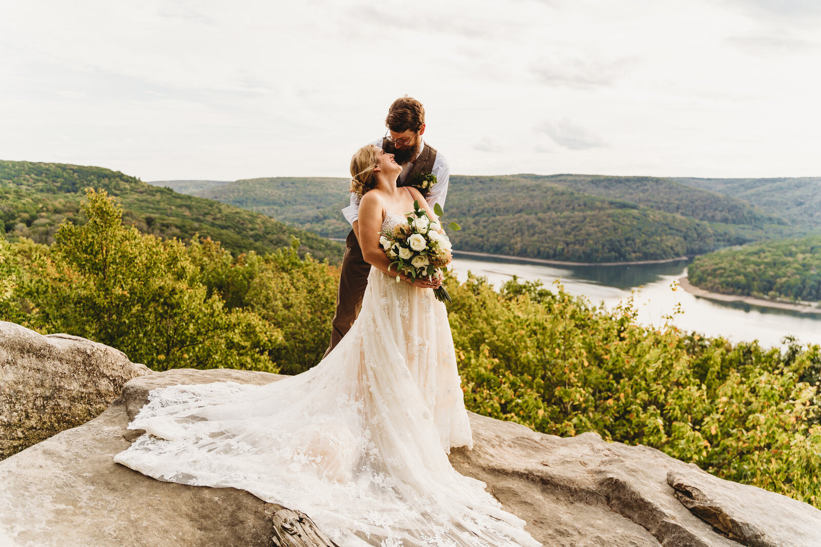 a couple in front of a scenic pennsylvania backdrop